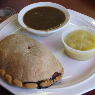 A Yooper Pasty in Paradise.  A meat pie with carrots, potatos and other veggies cooked inside. Gravy on the side. We discovered this little eatery on our visit in 2009. : Alan