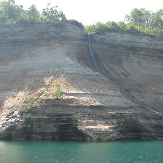 No way to show scale here, but if you look at the little notch to the right where the water fall runs into the lake you will see a kayak right where the falls reach the lake.