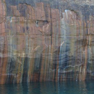 Various minerals leeching from the rock give the pictured rocks it's name.