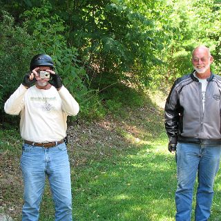 John hides behind the camera : Alan