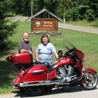 This was a nice place to stop. We took a break down by the lake and out of the heat in preparation for the last leg of this trip. Highway 61 (heading east in background) proved to be one of the most interesting roads on the trip with several 10 mph switchbacks. : Alan