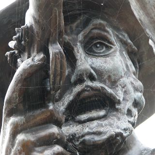 A spider has created it's own artwork on  the Mountain Man statue - Sycamore Shoals State Park.