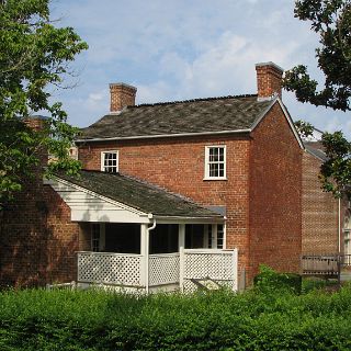 Andrew Johnsons home in Greeneville. His Tailor shop is preserved in the building in the background that was built around it.e