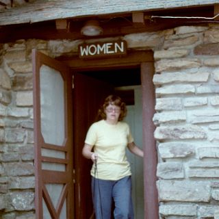 It looks like they added a new sign and a gutter over the last 34 years. (Susan in the same doorway in 1978)