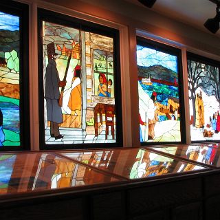 Painted glass tells a story of the Cherokee at the Red Clay visitor center.