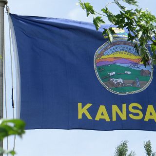 The flag standing straight out tells the story of our ride across the plains.