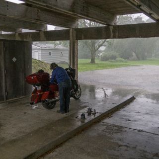 In pawnee Ill the skies opened up. Luckly we found an abandoned bank with a drive through to take cover in. : Touring